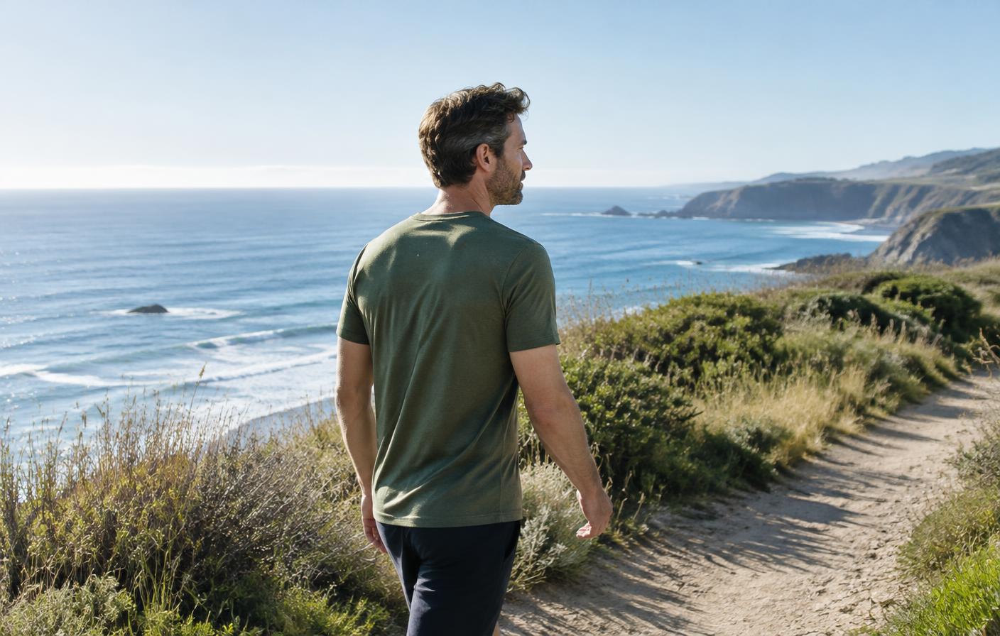 Man walking on a coastal trail, illustrating everyday physical activity rather than supplement results